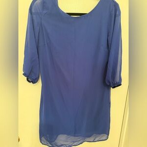 Sheer blue evening or dinner bow tie back dress